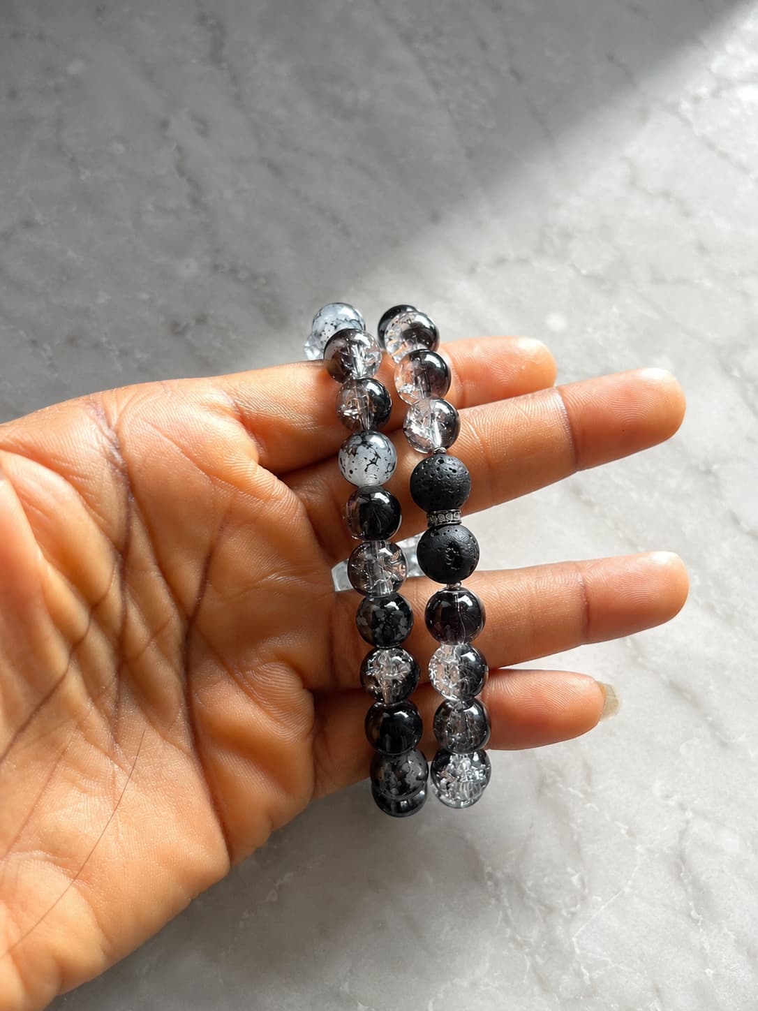 Customer Toheeb wearing oréva jewelry, dark background
